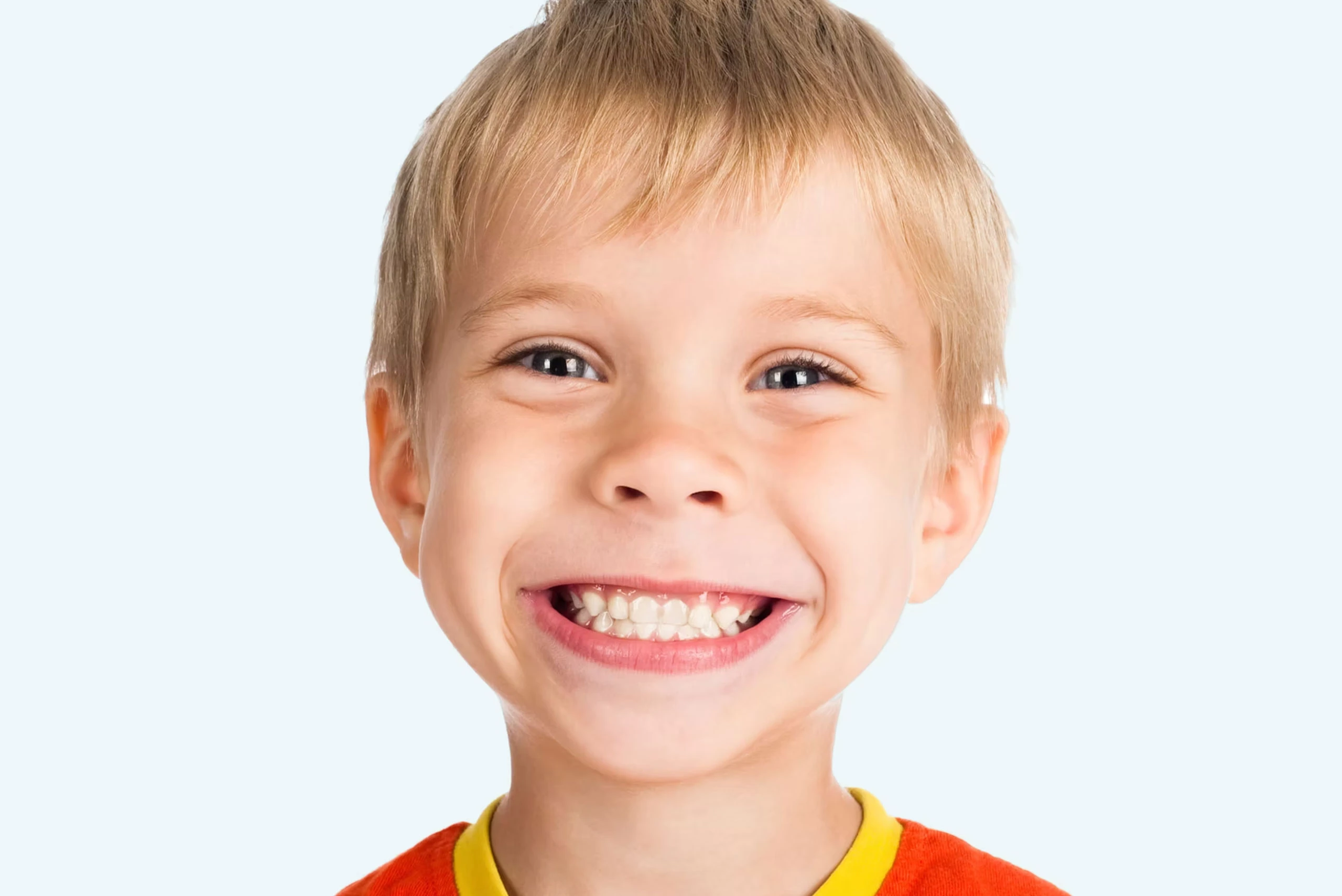 Happy child smiling showing teeth